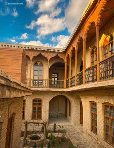 an old building with many windows and balconies