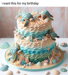 a birthday cake decorated with sea turtles and seashells