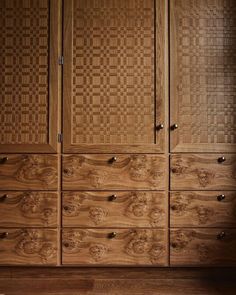 a large wooden cabinet with drawers in a room