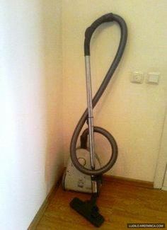 a vacuum is sitting on the floor next to a wall