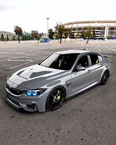 a silver car parked in a parking lot