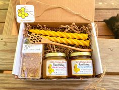 an open box with honey and bees on it