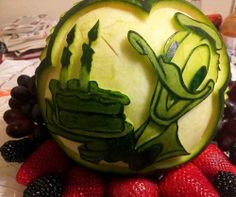 a watermelon carved to look like an alien