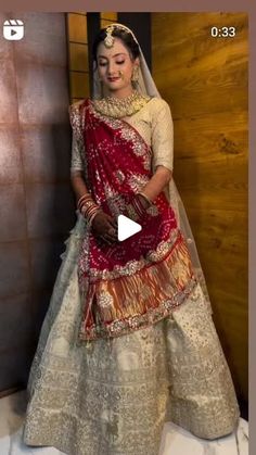 a woman in a red and white wedding dress