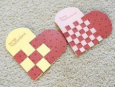 two heart shaped paper pieces on carpet with one cut in half and the other made out of