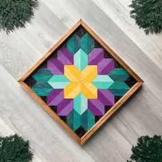 a wooden box that has some colorful designs on it