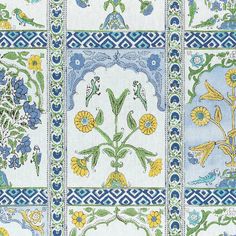 a blue and yellow wallpaper with floral designs on the sides, all in different colors