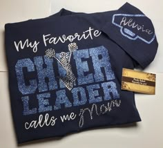 a t - shirt that says, my favorite cheer leader calls me mom on it