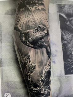 a man's arm with a turtle and sea creatures tattoo on the left forearm