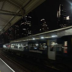 a train traveling through a city at night