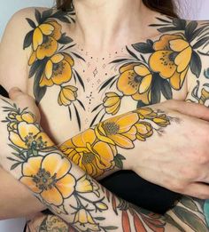 a woman with yellow flowers on her arm and chest wearing a face mask to protect it from the sun