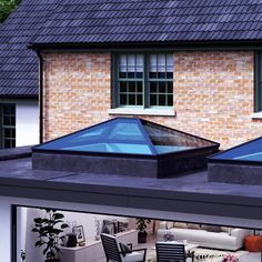 two skylights on the roof of a house