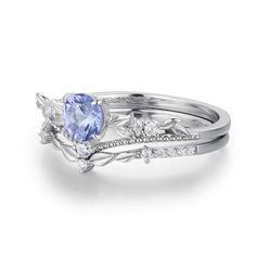 two wedding rings with an oval tanzante and diamonds