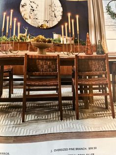 a dining room table with candles on it