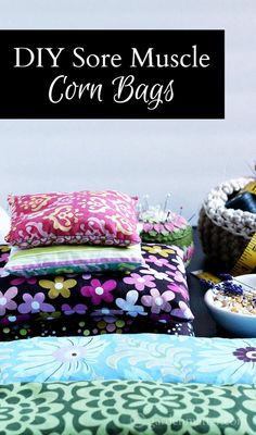 a table topped with lots of pillows covered in different colors and patterns next to a bowl of cereal