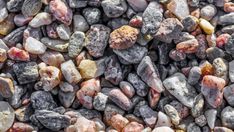 some rocks and gravel that are all different colors