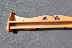 a wooden rack with two holes in it