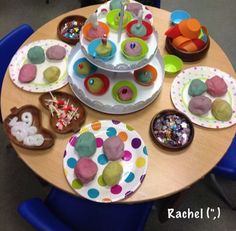 a table topped with lots of cupcakes and donuts