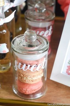 there are three jars that have different types of cookies in them and one has the word sweet on it