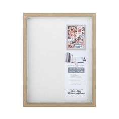 a wooden frame with white paper and pictures on the wall above it, along with an advertiser's guide