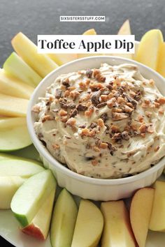 a white plate topped with an apple dip surrounded by sliced apples