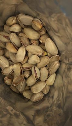 pistachio nuts are in a brown bag