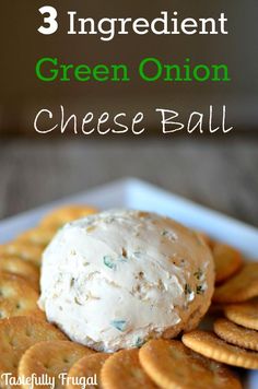 three ingredient green onion cheese ball on a plate with crackers