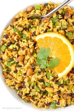 a white bowl filled with rice and orange slices