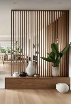 a living room filled with furniture and wooden slats