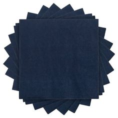 six dark blue napkins stacked on top of each other