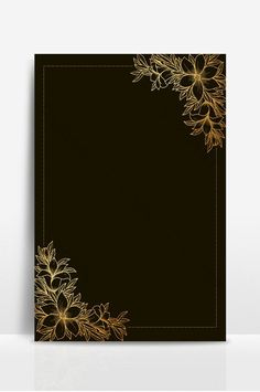 a black card with gold flowers on it