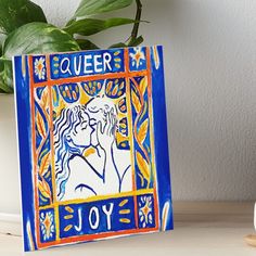 a blue and yellow tile with an image of a woman's face on it