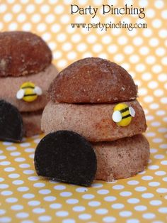 some kind of food that is made to look like cars with bees on their eyes