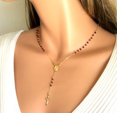 "Gold rosary necklace women. This is a beautiful Rosary inspired necklace. This gorgeous necklace is made of 3mm Ruby Red Crystals on a 14kt gold filled chain. Choose necklace length of 16\",18\" 20\", 22\" or 24\" length (this is the measurement around the neck only, does not include the drop) . Necklace closure connects at the 14kt Gold filled Miraculous Medallion at center of necklace, making this necklace so unique! A simple 3/4\" crucifix cross hangs from the drop. Drop measurement is 3\" a Catholic Jewelry Necklace, Christian Jewellery, Rosary Inspired Necklace, Rosary Necklaces, Gold Rosary Necklace, 14kt Gold Jewelry, Short Necklaces, Cross Necklace Women, Gold Rosary