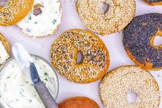 an assortment of donuts with frosting and sprinkles