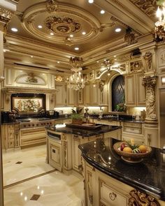 a fancy kitchen with marble counter tops and an island in the middle, surrounded by gold trimmings