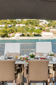 the table is set for four on the deck