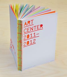 an open book with the title art center 2011 - 2012 written on it