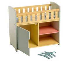 a wooden toy shelf with scissors and paper