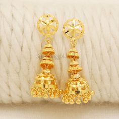 Celebrate the essence of Indian heritage with these radiant 22k gold earrings. Each earring is meticulously designed with traditional patterns that catch the light and add a regal touch to your look. Perfect for both festive occasions and elegant evenings, these earrings are a testament to the rich history of Indian jewelry, offering a blend of classic beauty and modern sophistication. 22k gold earrings handmade jewelry made in India Metal is Real Gold Not Filled or Not Gold Plated Metal - Yello Festival Celebration Jhumkas Drop Earrings, Gold Jhumkas With Latkans For Celebration, Hallmarked Drop Bridal Earrings For Festivals, Hallmarked Bridal Drop Earrings For Festivals, Gold Dangle Jhumkas For Festivals, Gold Earrings For Festive Celebrations, Gold Jhumkas With Matching Earrings For Celebration, Gold Earrings For Celebration And Festive Season, Festive Gold Earrings For Celebration