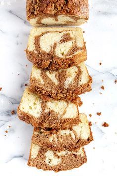 slices of cinnamon swirl bread stacked on top of each other in front of a marble counter