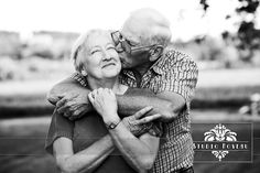 an older couple embracing each other in black and white