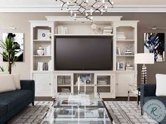 a living room filled with furniture and a flat screen tv on top of a entertainment center