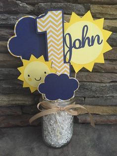 a mason jar filled with white rice next to a wooden sign that says 1 john