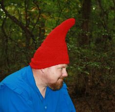 a man wearing a red hat in the woods