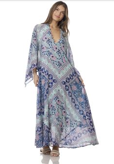 Indulge in the ethereal beauty of our Audrey Maxi Dress with Butterfly Sleeves in Blue. This stunning piece is crafted from 100% Indian cotton, making it soft and comfortable against your skin. The intricate butterfly sleeves add a touch of whimsy and romance, making you feel like a true goddess. The dress features a beautiful blue print that will transport you to a dreamy paradise. The flowy maxi length adds a touch of elegance and grace to your every step. Whether you're strolling along the be Blue Breezy Flowy Cover-up, Blue Flowy Breezy Cover-up, Spring Flowy Dresses With Kimono Sleeves, Spring Dresses With Flowy Fit And Kimono Sleeves, Spring Dresses With Flowy Kimono Sleeves, Flowy Spring Dresses With Kimono Sleeves, Spring Dresses With Kimono Sleeves, Ethereal Beach Dress For Spring, Ethereal Spring Beach Dress