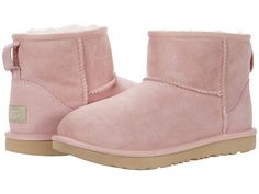 UGG Kids Classic Mini II (Little Kid/Big Kid) (Pink Cloud) Girls Shoes Crafted from supple suede and cozy shearling these UGG Kids Classic Mini II round-toe pull-on boots are the ultimate sweater-weather accessory! UGG Signature Twinface sheepskin uppers are treated on both sides to provide maximum softness and comfort. Pretreated for water and stain resistance. UGGpureâ? lining and footbed keep feet feeling breathable and dry. Features a foam cushi #UGGKids #Shoes #Boot #GeneralBoot #Pink Cute Ugg Boots, Boot Closet, Pink Ugg Boots, Ugg Ugg, Ugg Boots Sale, Still Waiting For You, Tall Uggs, Ugg Boots Outlets, Ugg Kids