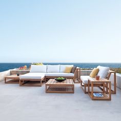 an outdoor seating area overlooking the ocean