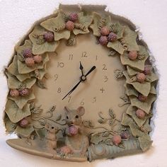 a clock with flowers and mice on it