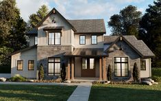 a large gray house with lots of windows on the front and side of it's roof